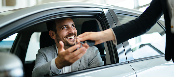 man in new car